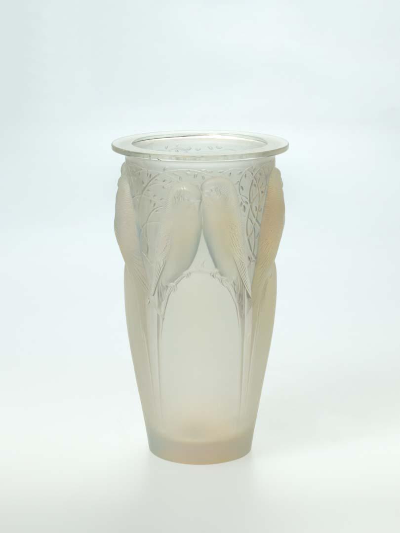 Artwork Vase:  Ceylan this artwork made of Clear glass, mould-blown cylindrical shape, with a design of budgerigars, frosted finish and traces of blue staining, created in 1925-01-01