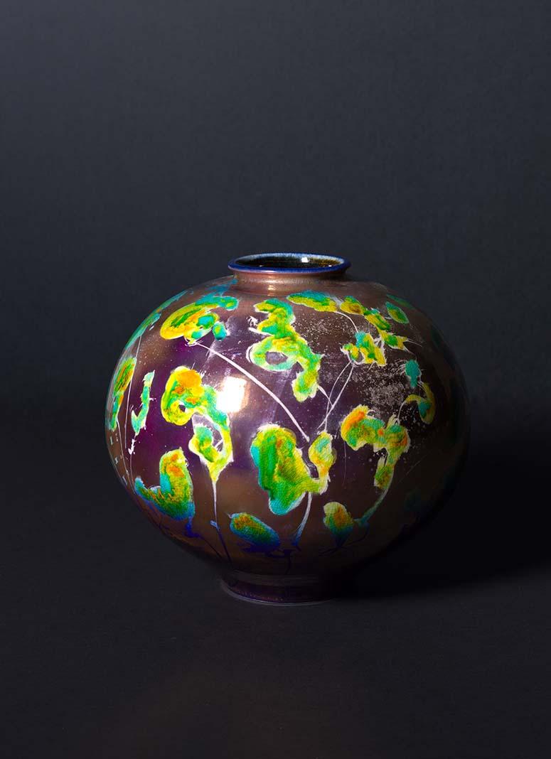 Artwork Vase this artwork made of Porcelain, wheelthrown with coloured glazes and etched lustre, created in 1991-01-01