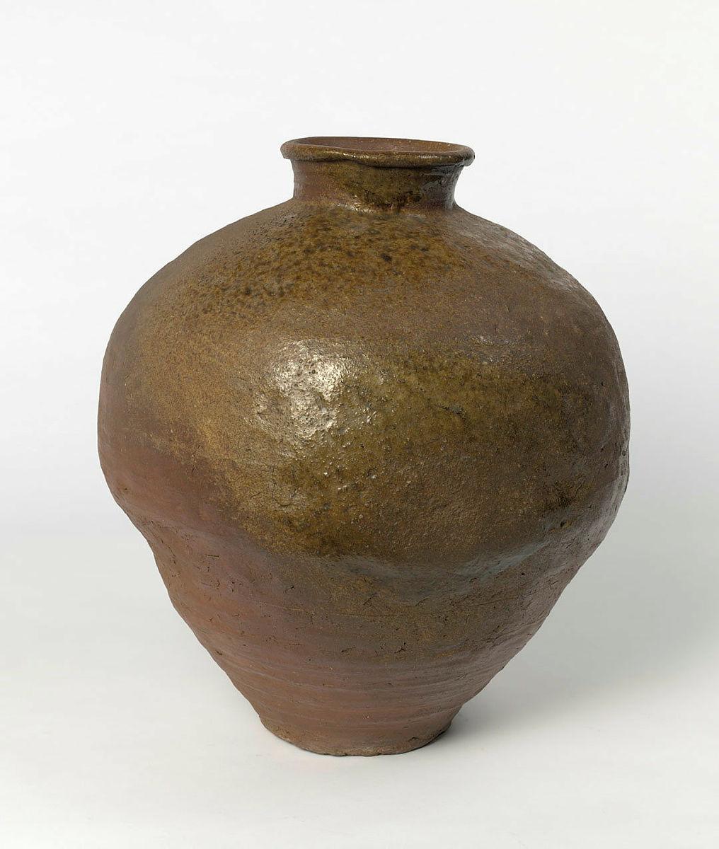 Artwork Narrow-necked jar (tsubo) this artwork made of Stoneware, dark brown clay hand built in three sections with ash deposit, created in 1400-01-01
