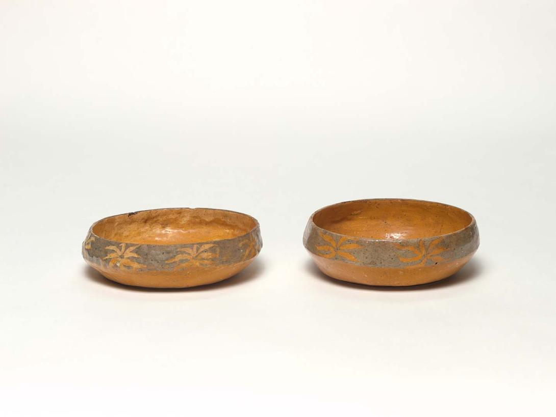 Artwork Pair of bowls this artwork made of Earthenware, hand-built buff ochre clay with grey slip decoration incised with flannel flower motifs, created in 1927-01-01