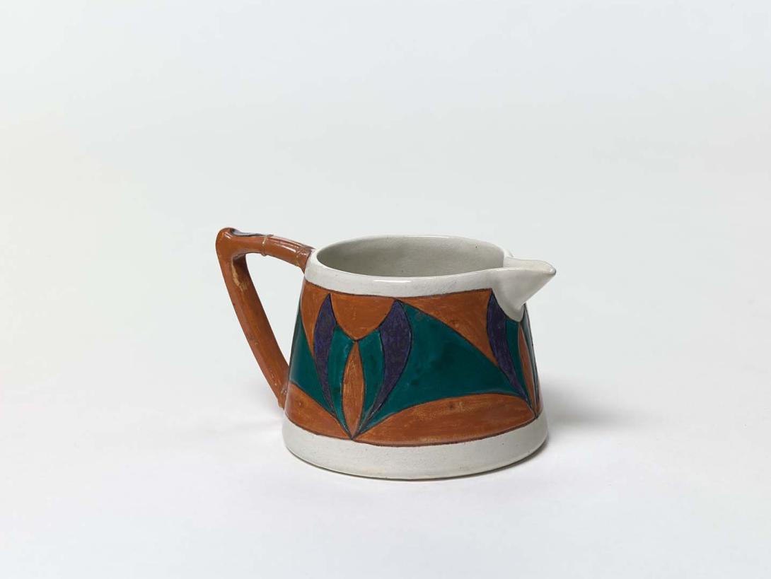 Artwork Jug this artwork made of Earthenware, hand-built cream clay with rust, deep green and blue underglaze colours, created in 1922-01-01