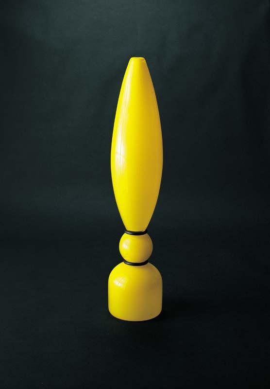 Artwork Vase this artwork made of Hot-worked yellow glass with bands of black rubber, created in 1992-01-01