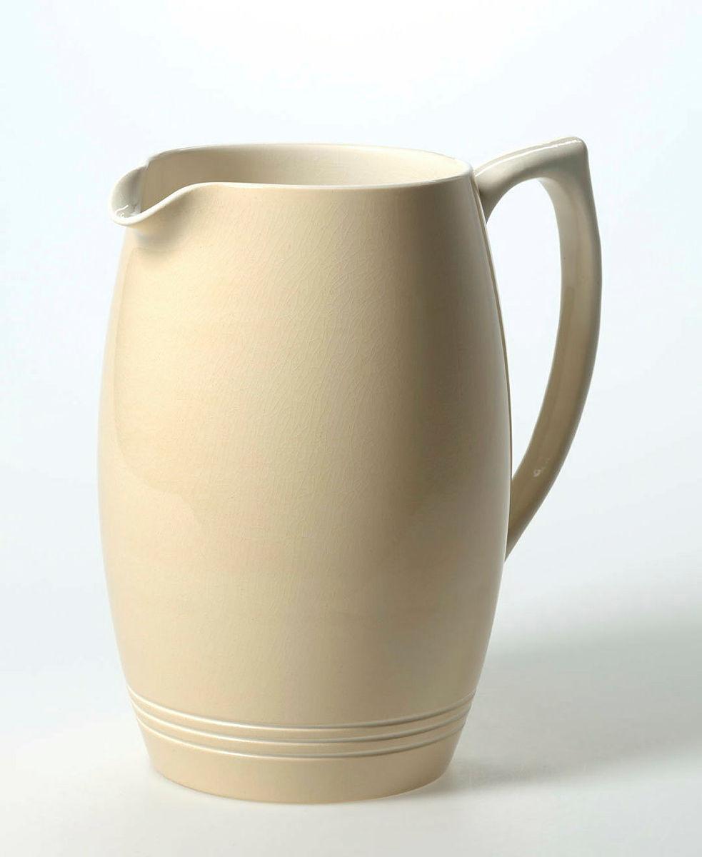 Artwork Jug this artwork made of Earthenware, slip-cast and dipped straw coloured slip, machine turned with three lines and clear glaze, created in 1940-01-01