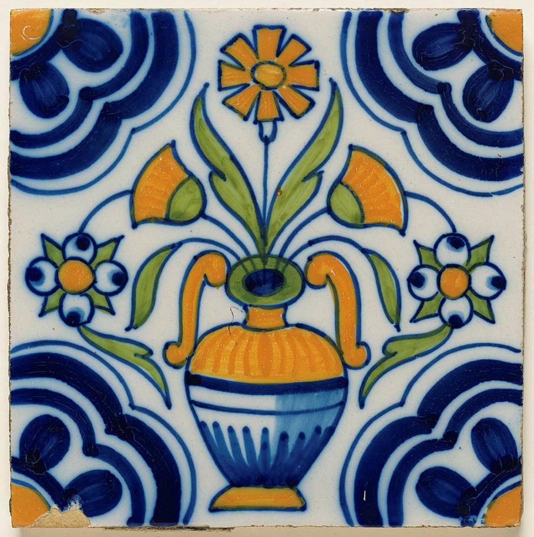 Artwork Tile:  (Vase of flowers with corner daisy motif) this artwork made of Earthenware, slab rolled and tin glazed with cobalt, ochre and light green decoration, created in 1650-01-01