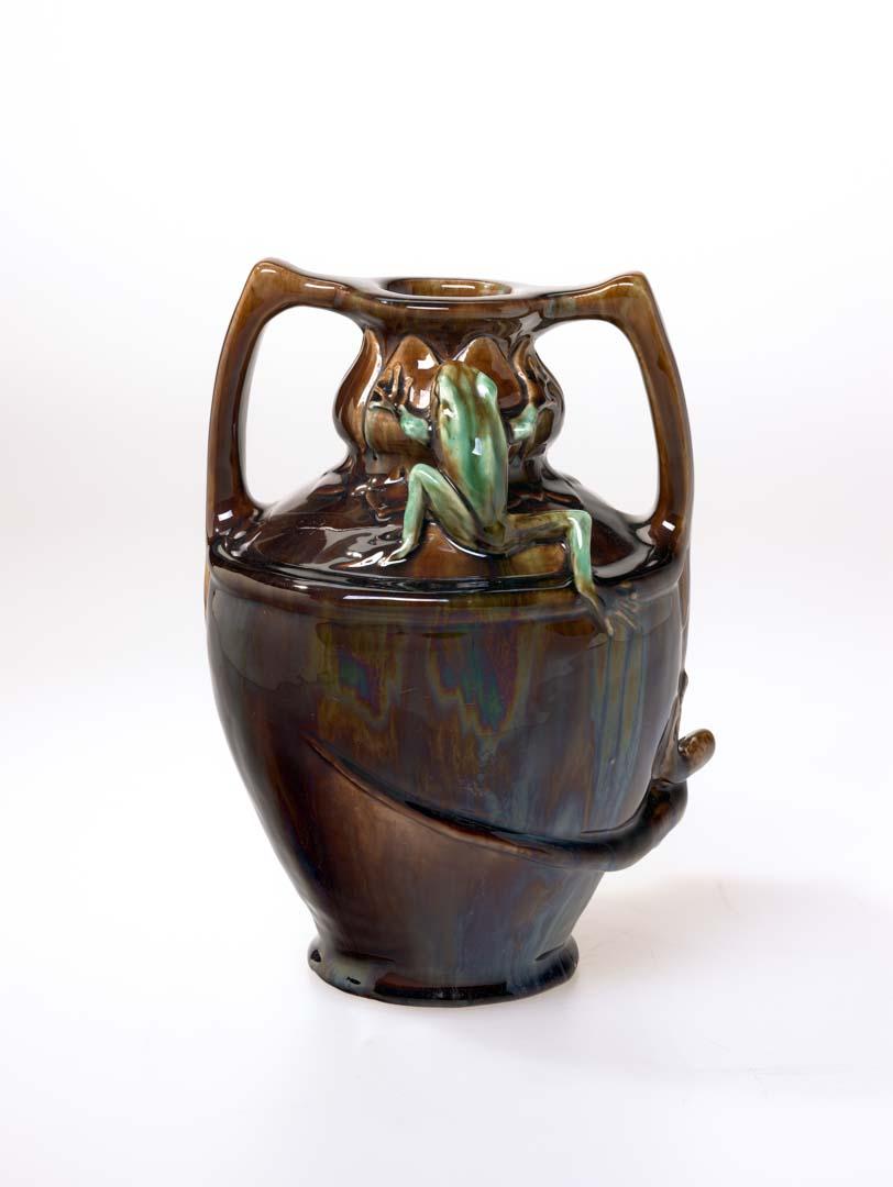 Artwork Two-handled vase this artwork made of Earthenware, hand built and modelled with a lizard and a frog, glazed brown and green