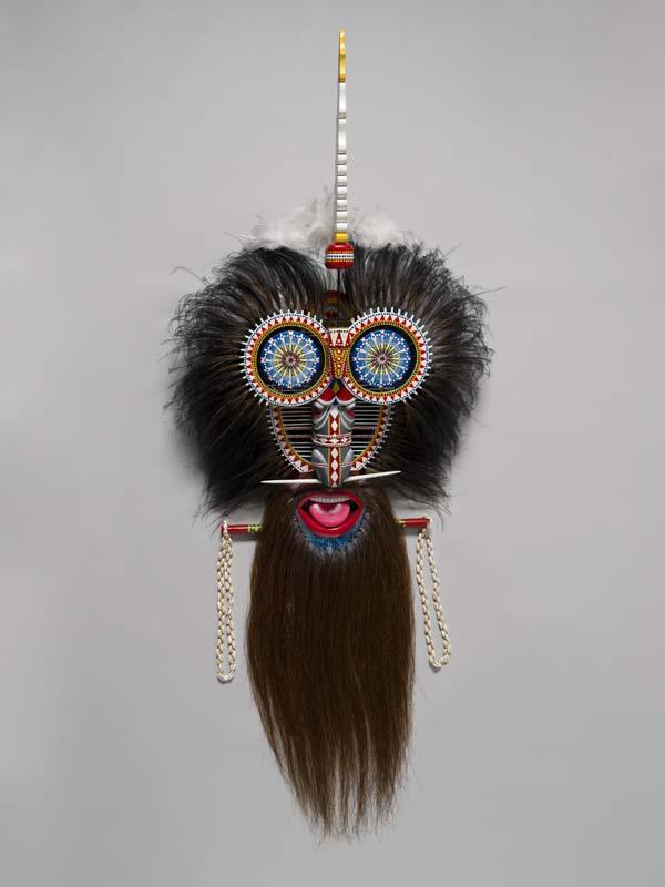 Artwork Wene-Wenel/Gauguau Mawa (very powerful witchdoctor's mask) this artwork made of Wood, synthetic polymer paint, shells, beads, white feathers, horse hair, cassowary and emu feathers