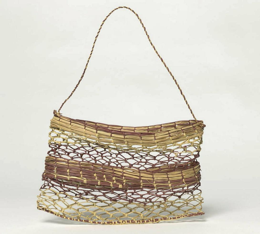 Artwork Bag this artwork made of Knotted pandanus (Pandanus spiralis) fibre with natural dyes and string handle, created in 2001-01-01