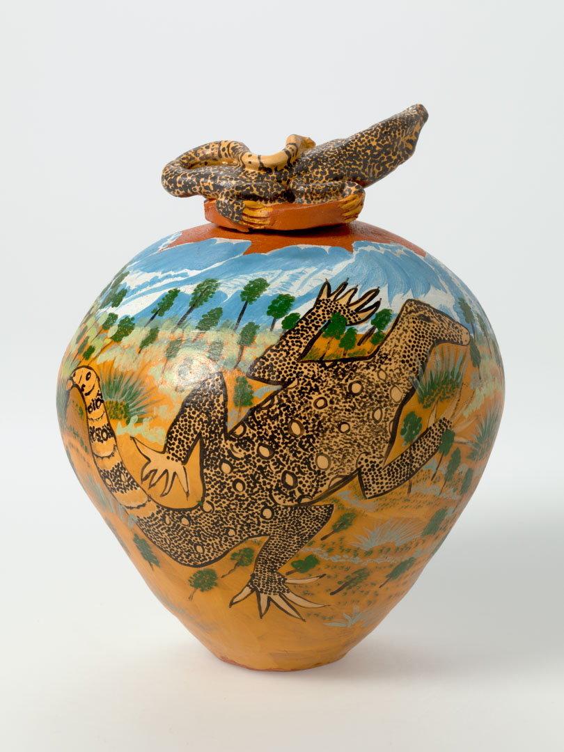 Artwork Pot:  Tompa (Perentie) this artwork made of Earthenware, hand-built terracotta clay with underglaze colours, created in 2002-01-01
