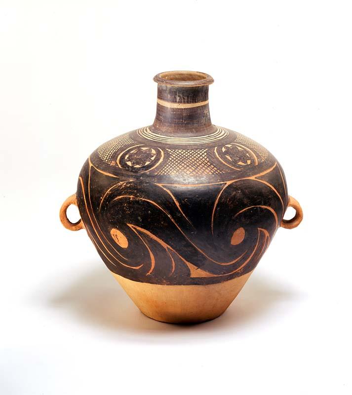 Artwork Storage jar (kuan) this artwork made of Swelling earthenware shape, narrowing to the base, with narrow neck and two lugs set vertically at the maximum diameter, painted with black pigment in a band of large swirls below a band of circular panels enclosing a star motif reserved on a cross-hatched ground