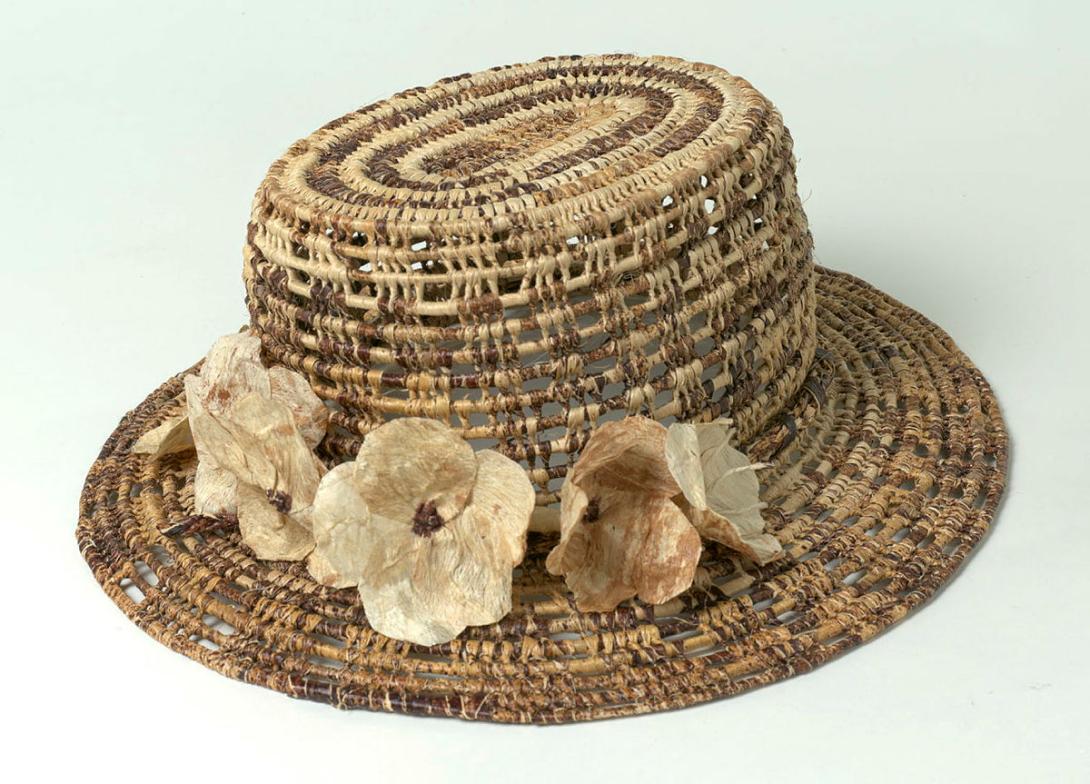 Artwork Hat this artwork made of Woven banana fibre over coconut midrib, bark cloth, created in 1997-01-01