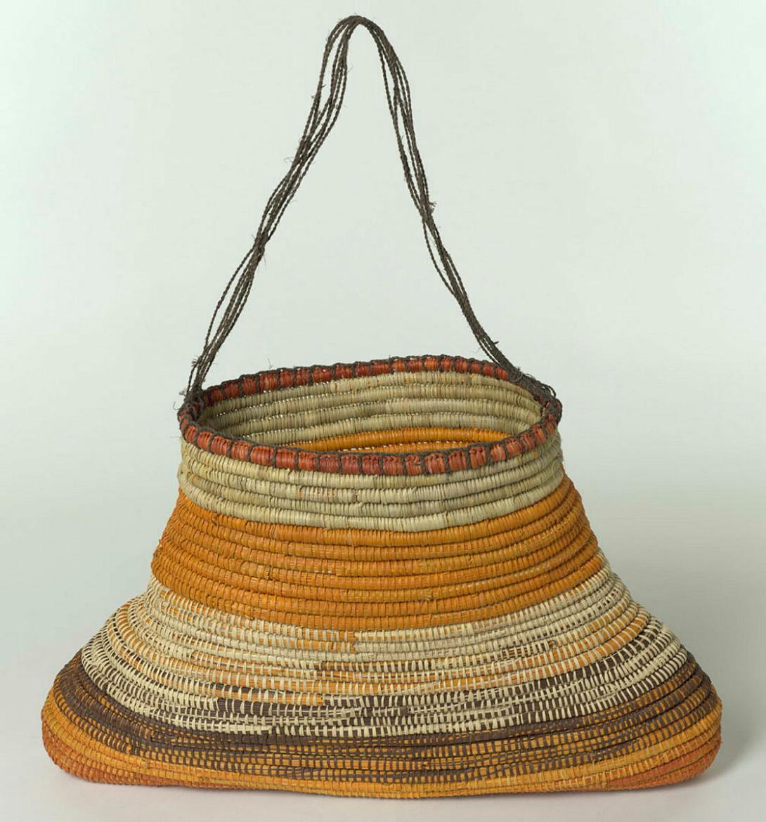 Artwork Triangular basket this artwork made of Coil-woven pandanus palm leaf (Pandanus spiralis), natural dyes with bark fibre string, created in 2004-01-01