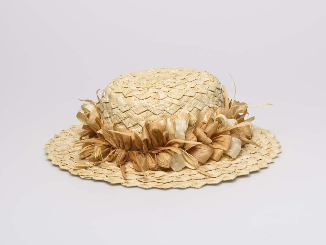 Artwork Hat this artwork made of Woven corn husk, created in 2007-01-01