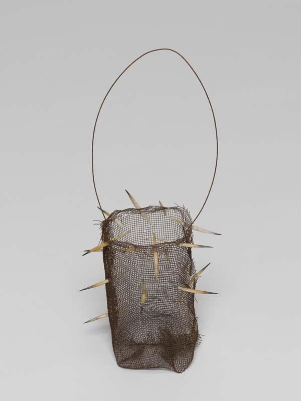 Artwork Narrbong (String bag) this artwork made of Rusted gauze wire with echidna quills, created in 2007-01-01