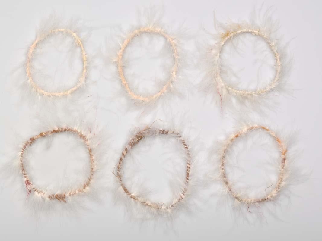 Artwork Ceremonial armbands this artwork made of Bark fibre string, cotton thread with commercial feathers, created in 1996-01-01