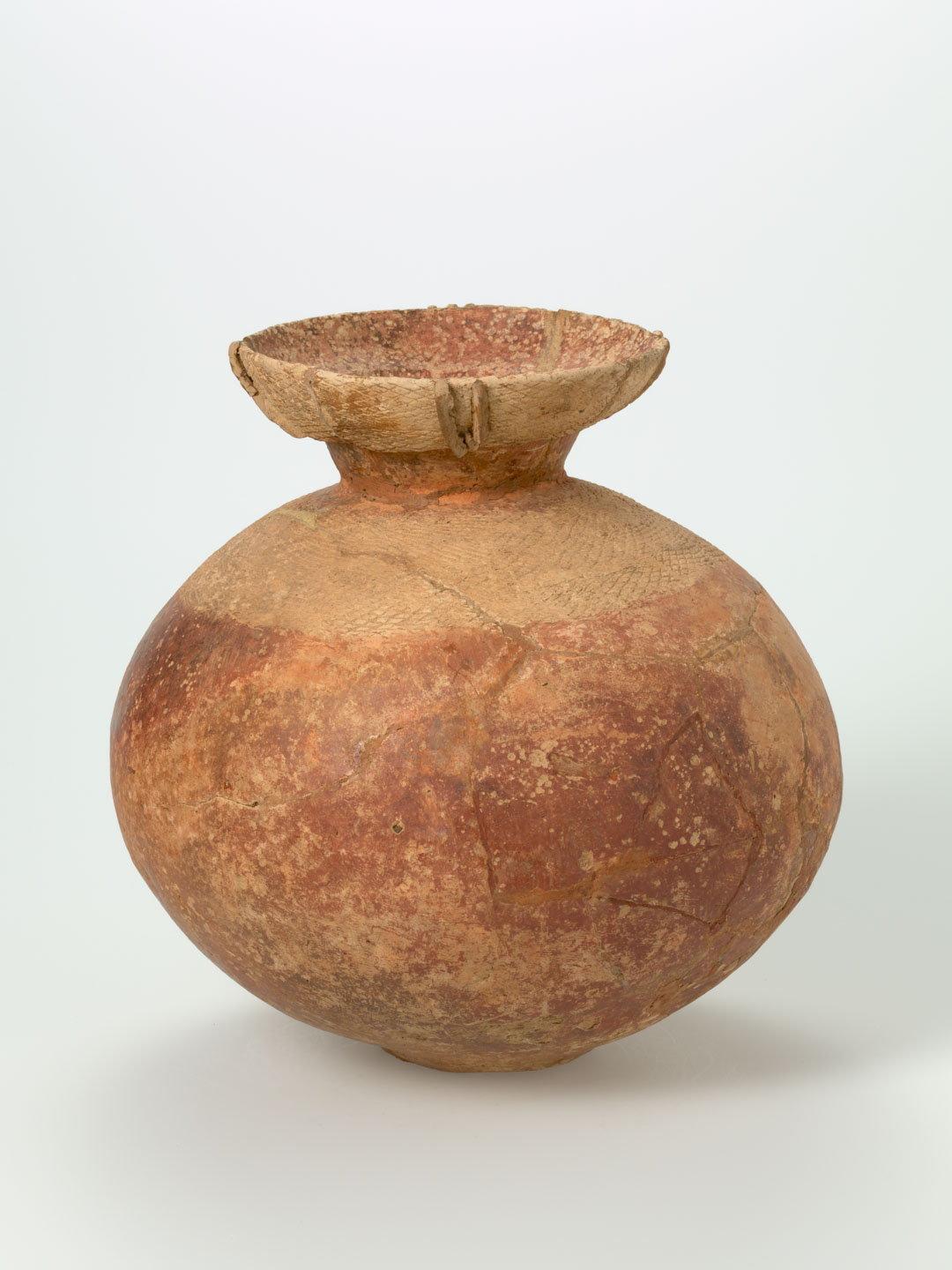 Artwork Jar this artwork made of Earthenware, hand-built spherical form with net design incised at shoulder and on flaring lip
