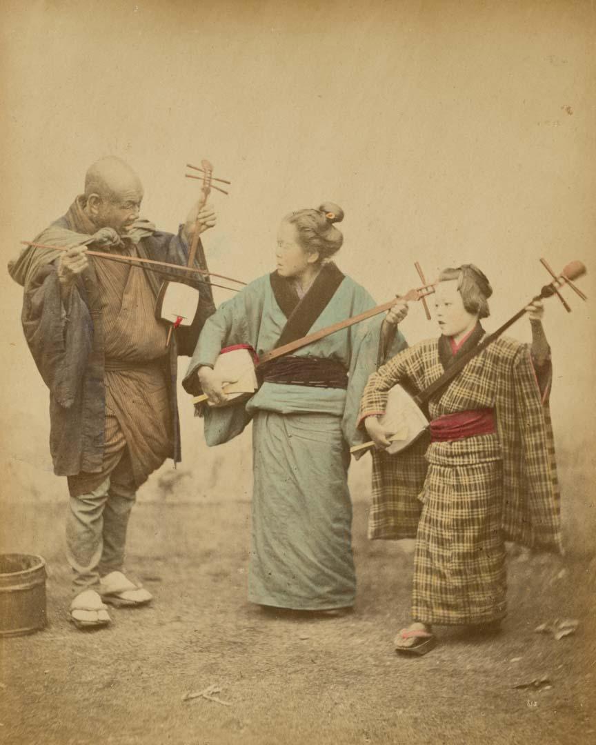 Artwork (Shamisen street musicians) (from 'Japan' album) this artwork made of Hand-coloured albumen photograph on board (originally bound in an album), created in 1867-01-01