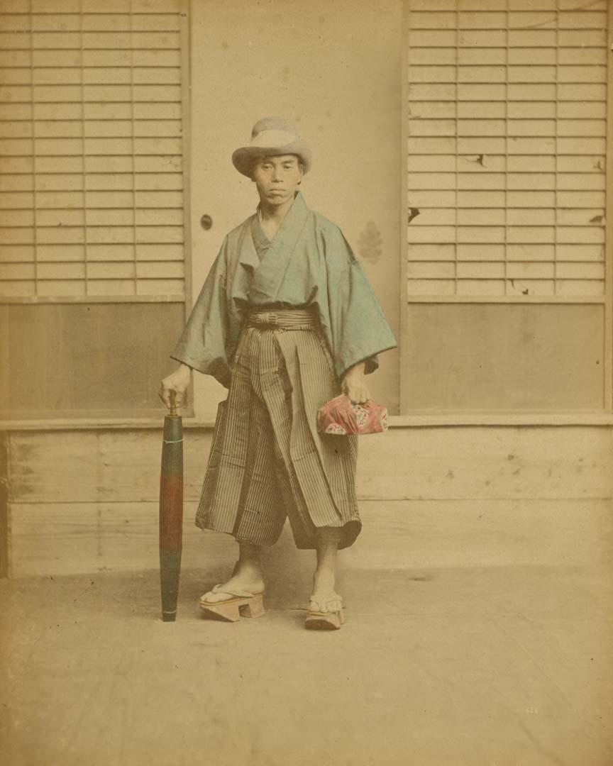 Artwork (Travelling nobleman) (from 'Japan' album) this artwork made of Hand-coloured albumen photograph on board (originally bound in an album), created in 1870-01-01