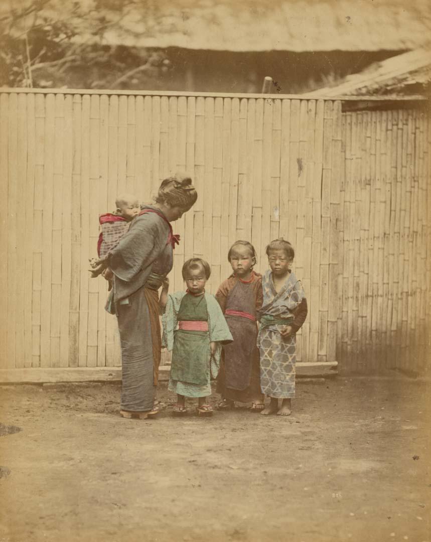 Artwork (Mother with children) (from 'Japan' album) this artwork made of Hand-coloured albumen photograph on board (originally bound in an album), created in 1867-01-01