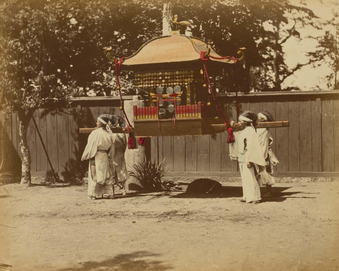 Artwork (Shinto priests with portable mikoshi shrine) (from 'Japan' album) this artwork made of Hand-coloured albumen photograph on board (originally bound in an album), created in 1867-01-01