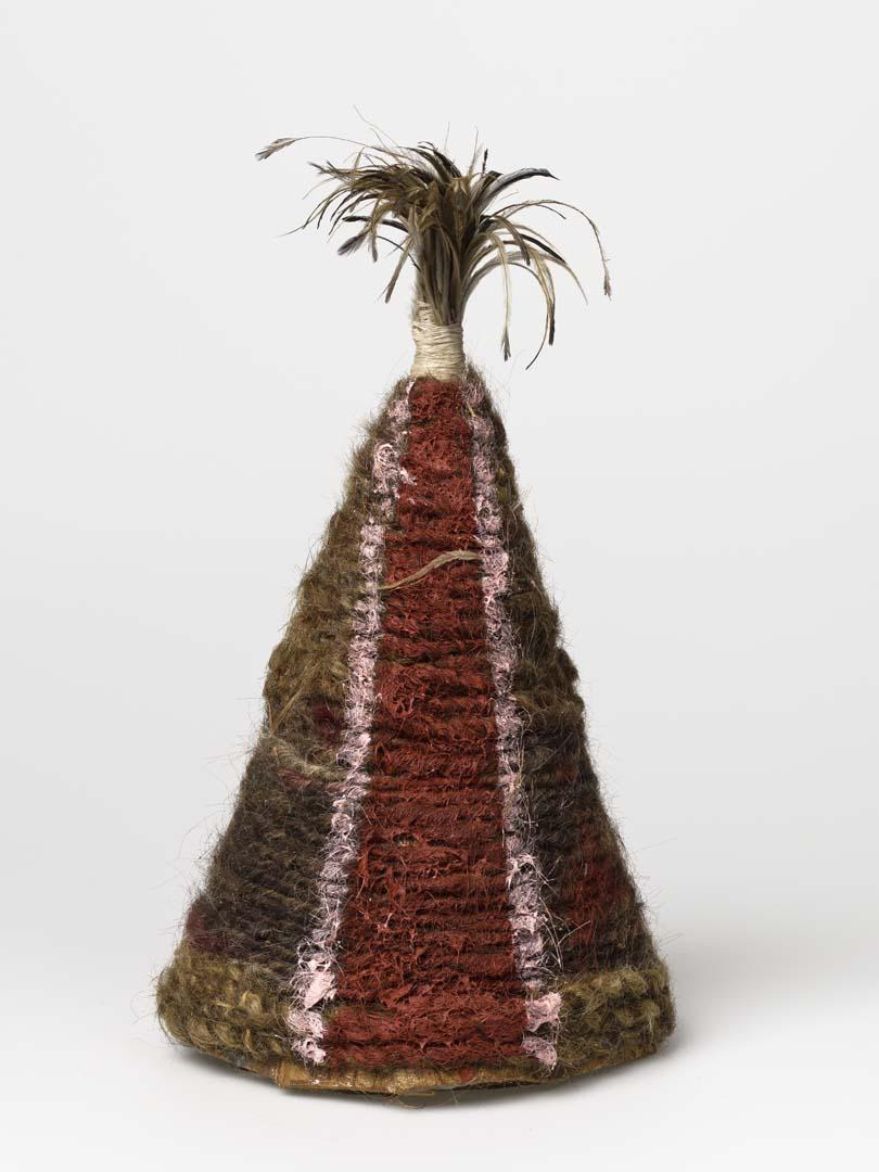 Artwork Ceremonial dance hat this artwork made of Paperbark with wood, string, human hair, natural pigments and emu feathers, created in 2010-01-01