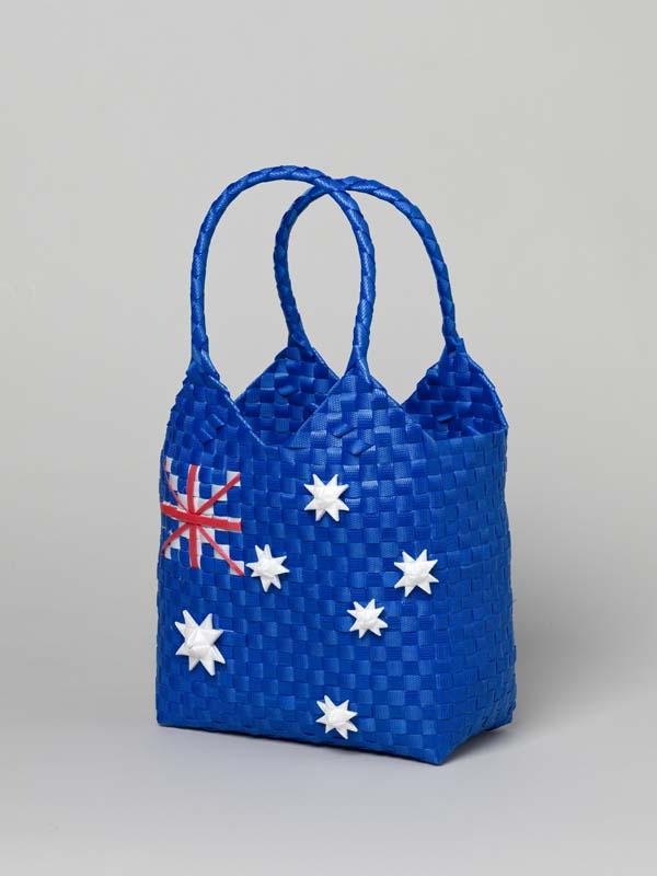 Artwork Basket with short handles this artwork made of Woven polypropylene tape (blue with Australian flag motif), created in 2011-01-01
