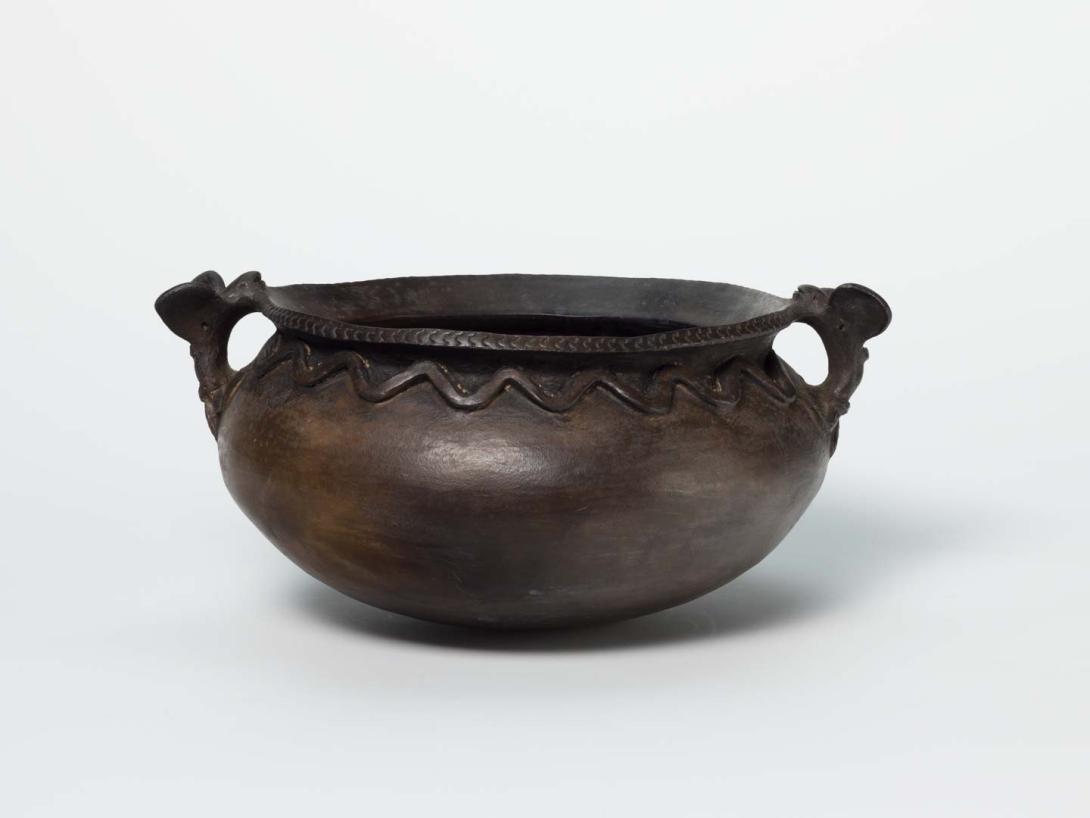 Artwork Cooking pot with bat handles this artwork made of Hand-built earthenware with applied decoration and beeswax, created in 1997-01-01
