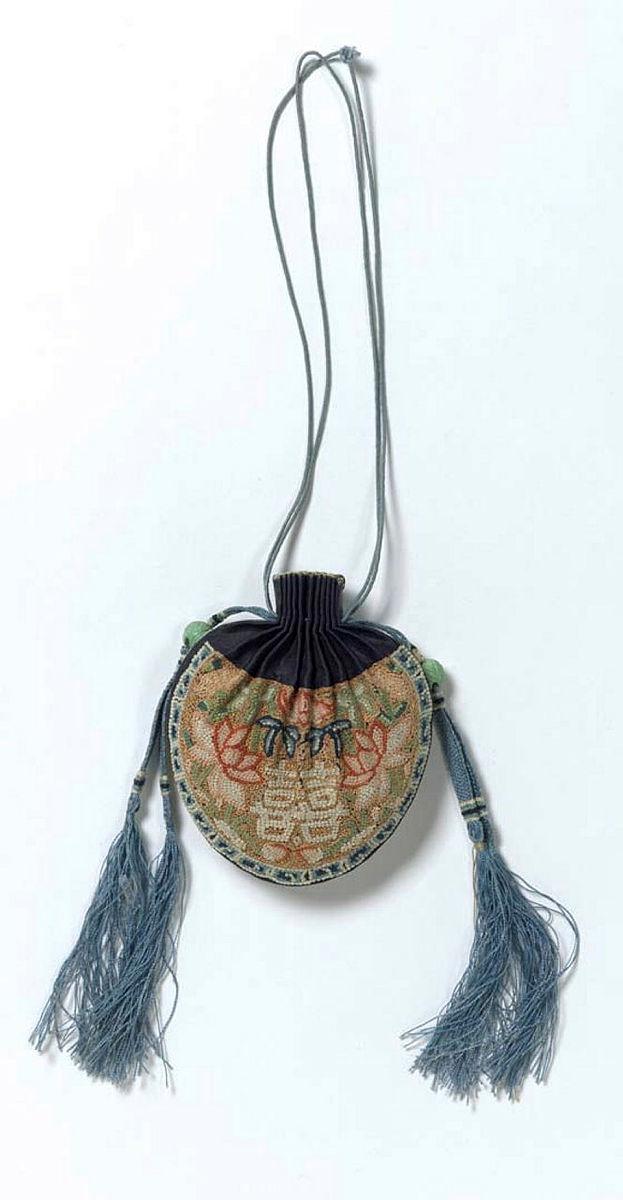 Artwork Purse worn on the trousers of a groom this artwork made of Silk, gold thread, embroidery, beads, scented raw silk with double happiness symbol, created in 1850-01-01