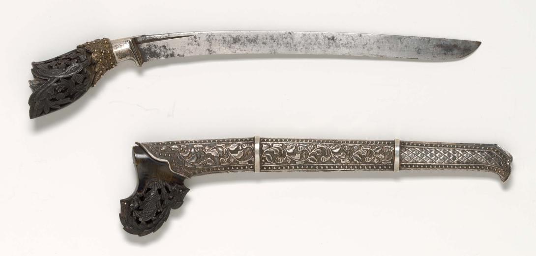 Artwork Tumbok lada dagger this artwork made of Horn, repousséd silver, gold filigree, steel blade, created in 1800-01-01