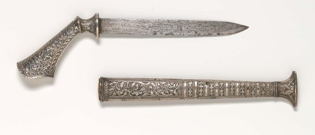 Artwork Badek dagger this artwork made of Repousséd silver, wooden scabbard interior, watered-iron blade, created in 1915-01-01