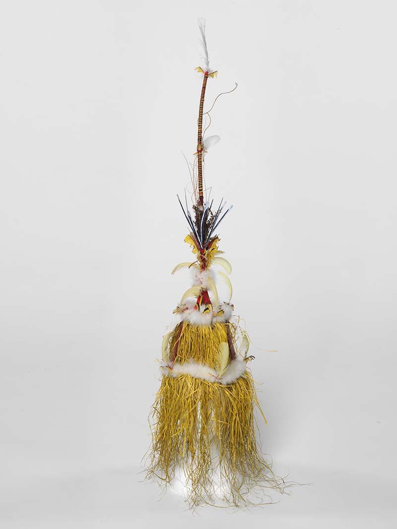 Artwork Ralavon this artwork made of Tokatokoi headdress: shredded sago fibres, dyes, wool, feathers, dried fern over split cane armature and stick