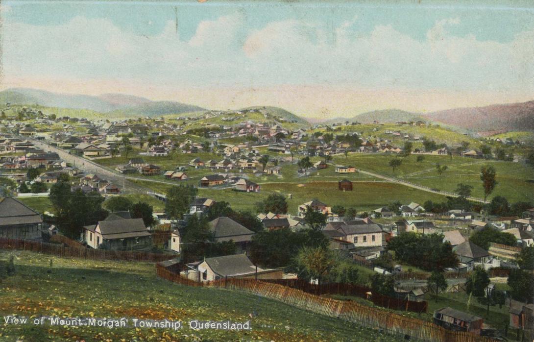 Artwork View of Mount Morgan township, Queensland (from 'Coloured Shell Series: Queensland Views') this artwork made of Postcard: Colour lithograph on paper, created in 1905-01-01