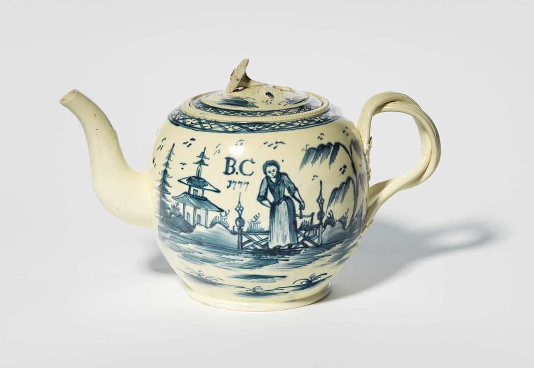 Artwork Teapot, decorated with blue and white design showing a woman in European dress carrying balance scales in a chinoiserie landscape this artwork made of Creamware with blue underglaze, created in 1777-01-01