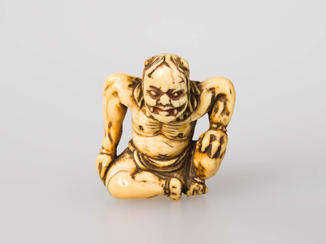 Artwork Netsuke: (Oni) this artwork made of Carved ivory, created in 1800-01-01