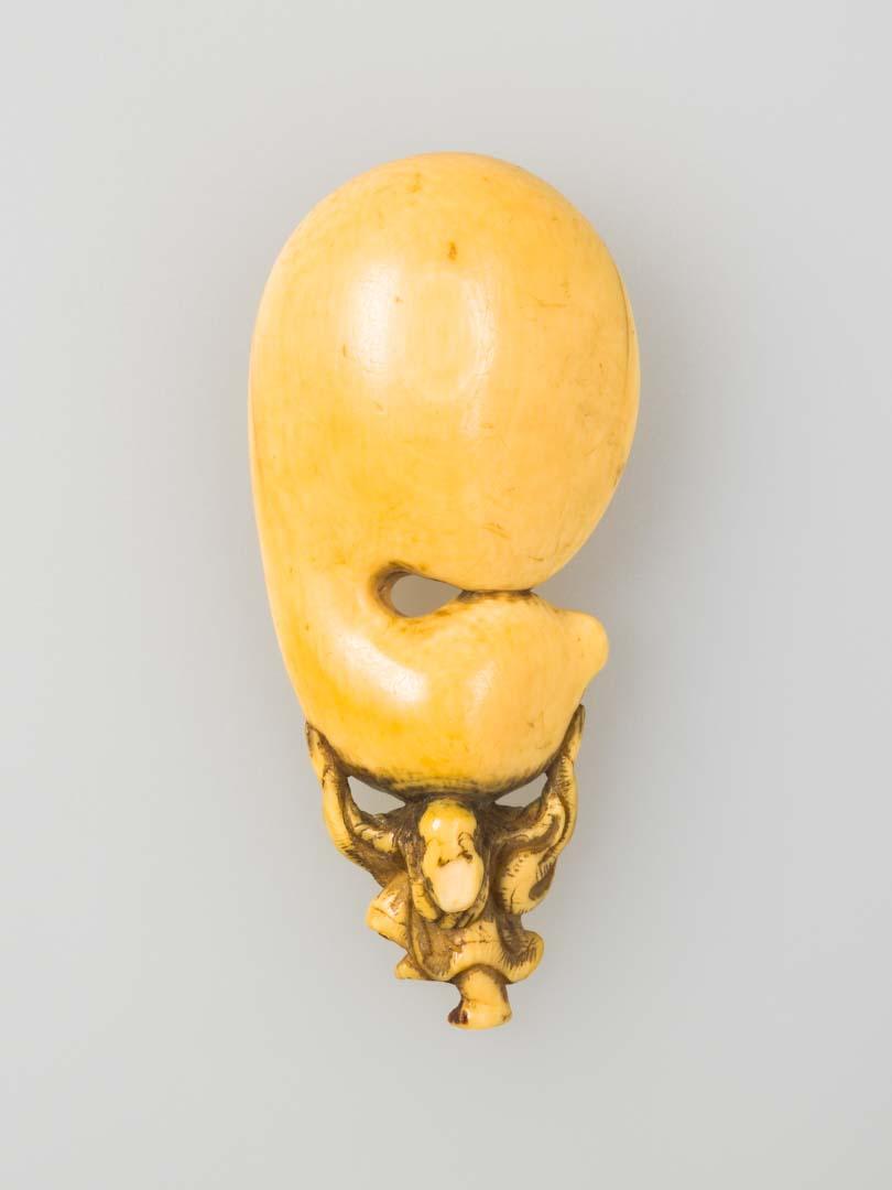Artwork Netsuke: (figure carrying giant gourd) this artwork made of Carved ivory, created in 1800-01-01