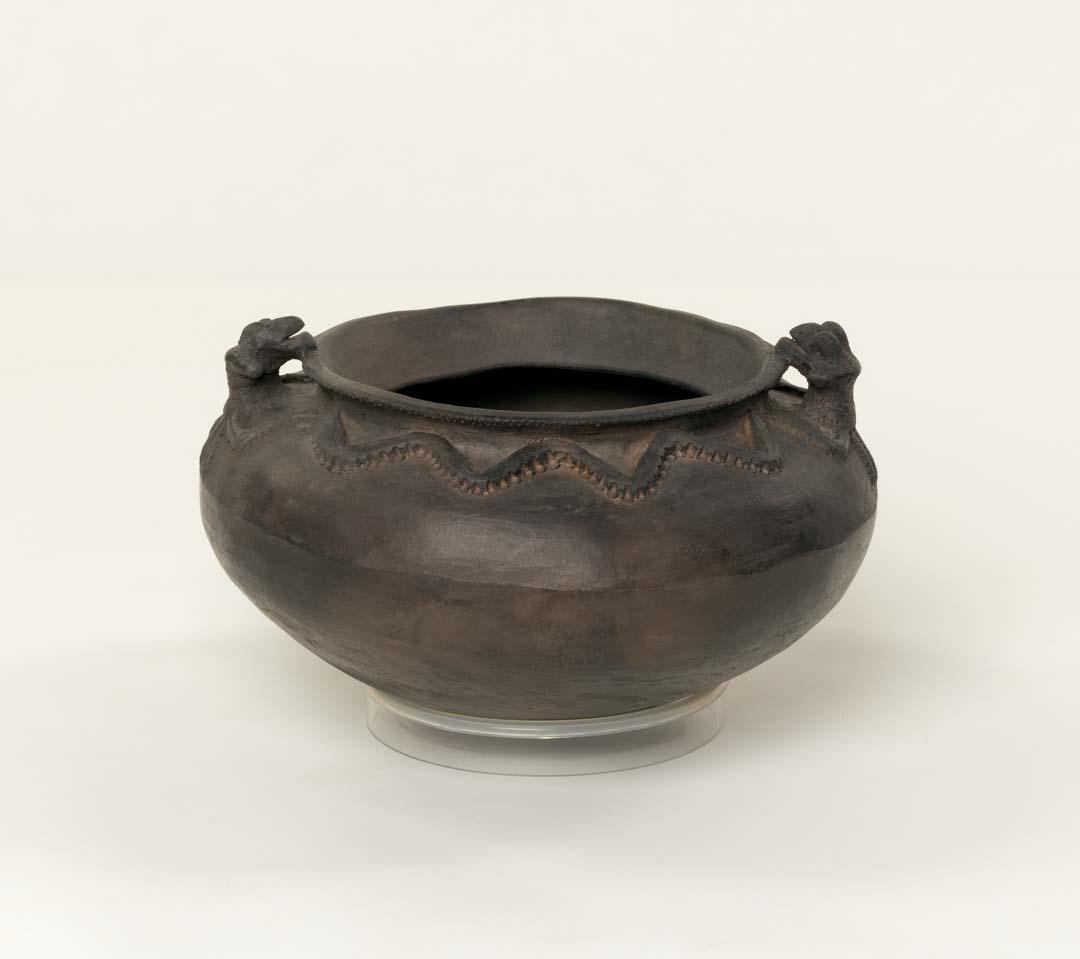 Artwork Cooking pot with bat handles this artwork made of Hand-thrown earthenware with applied decoration and beeswax, created in 2015-01-01