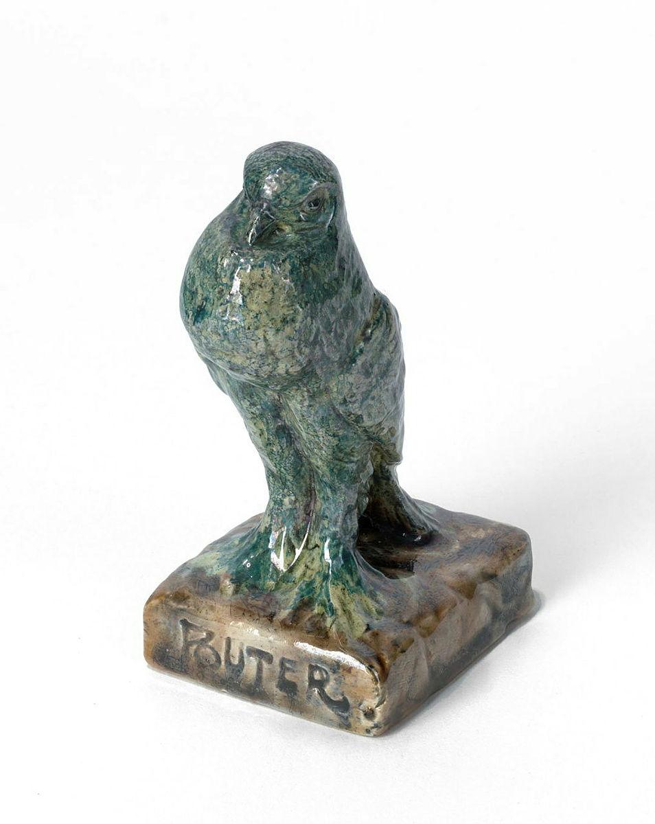 Artwork Pouter pigeon this artwork made of Earthenware, modelled with a bird on a pedestal and with lustre blue glaze, created in 1920-01-01