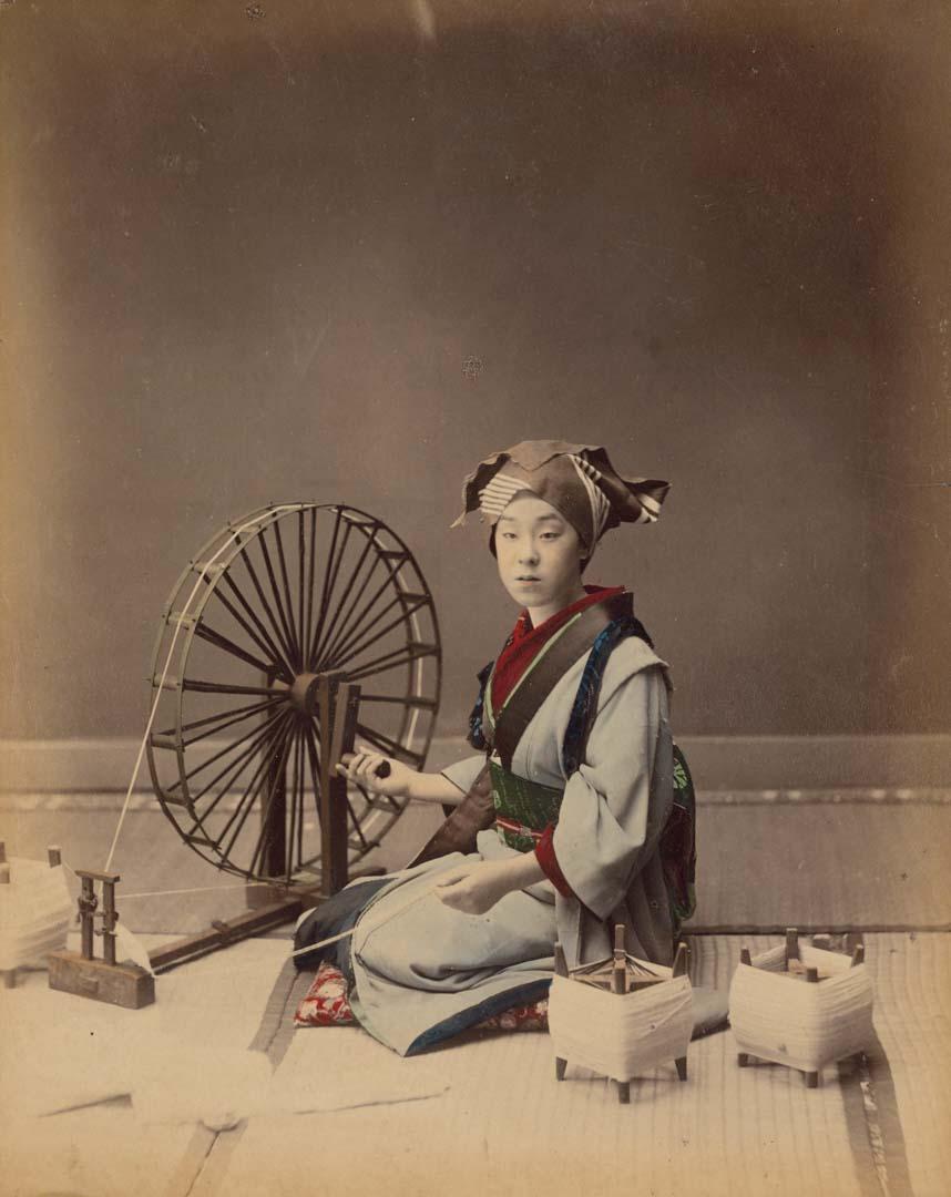 Artwork Woman spinning cotton this artwork made of Hand-coloured albumen silver photograph