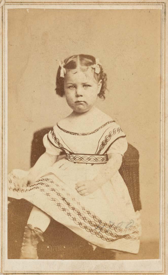 Artwork (Pouting young girl with hair bows) this artwork made of Albumen photograph on paper, created in 1865-01-01