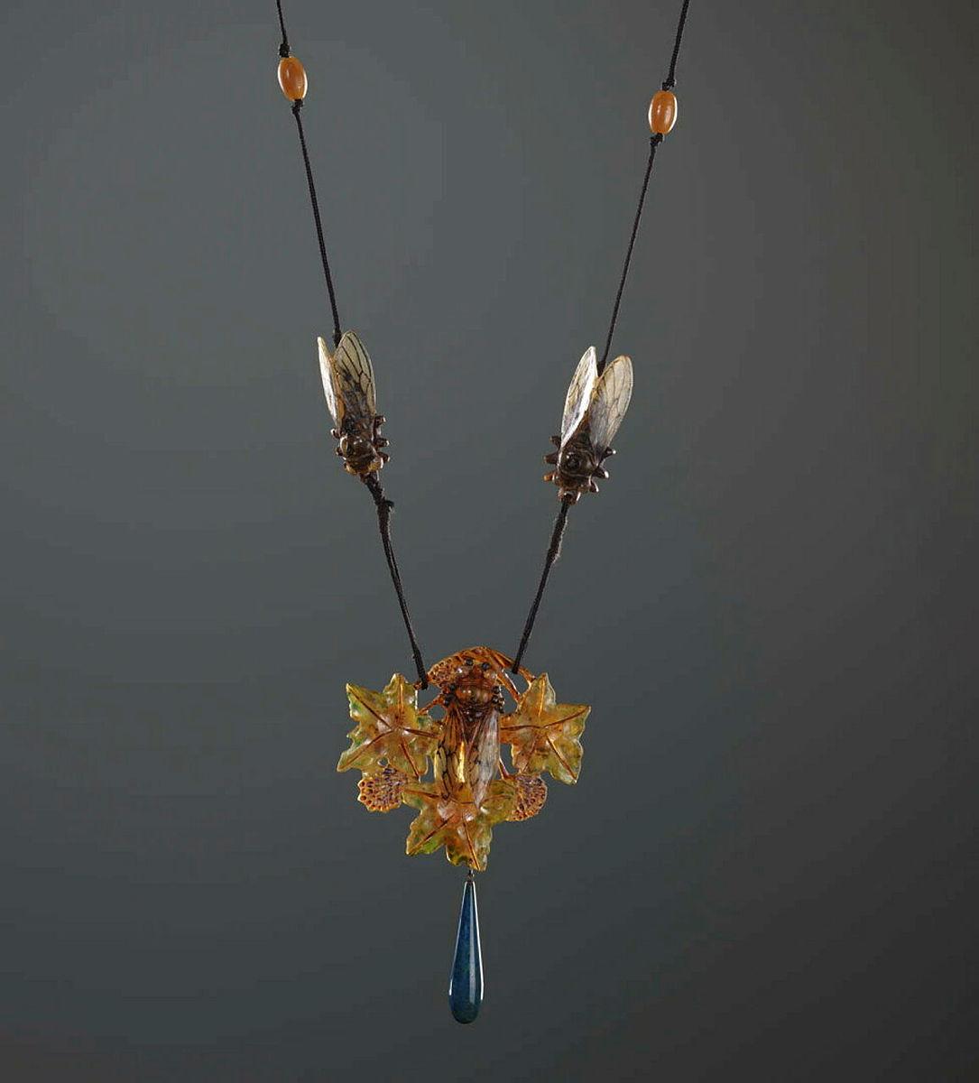 Artwork Cicada pendant necklace this artwork made of Buffalo horn, blue glass, synthetic cord and plastic, created in 1900-01-01