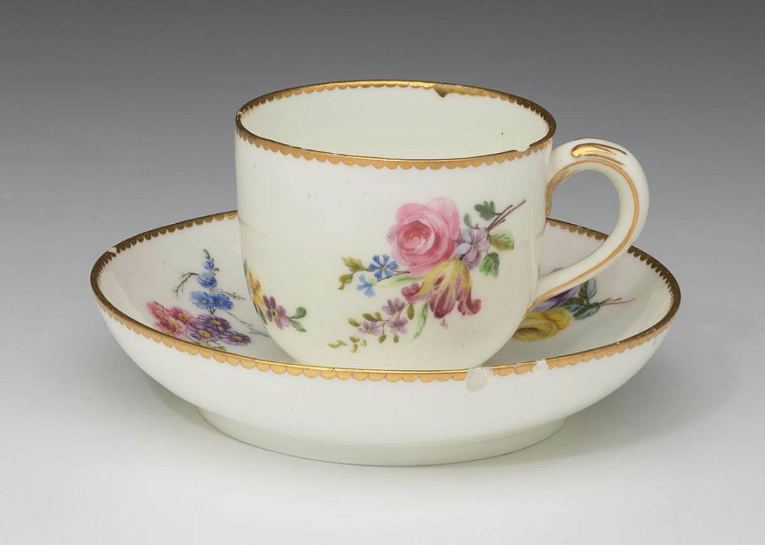 Artwork Cup and saucer this artwork made of Soft porcelain body decorated with polychrome sprigs of flowers with gilt dentil rim, created in 1755-01-01