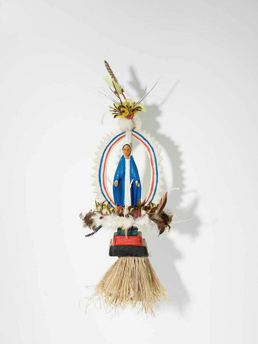 Artwork Mary this artwork made of Tokatokoi, headdress: wood, feathers, plastic Virgin Mary figurine, synthetic polymer paint, grass fibre, created in 2011-01-01