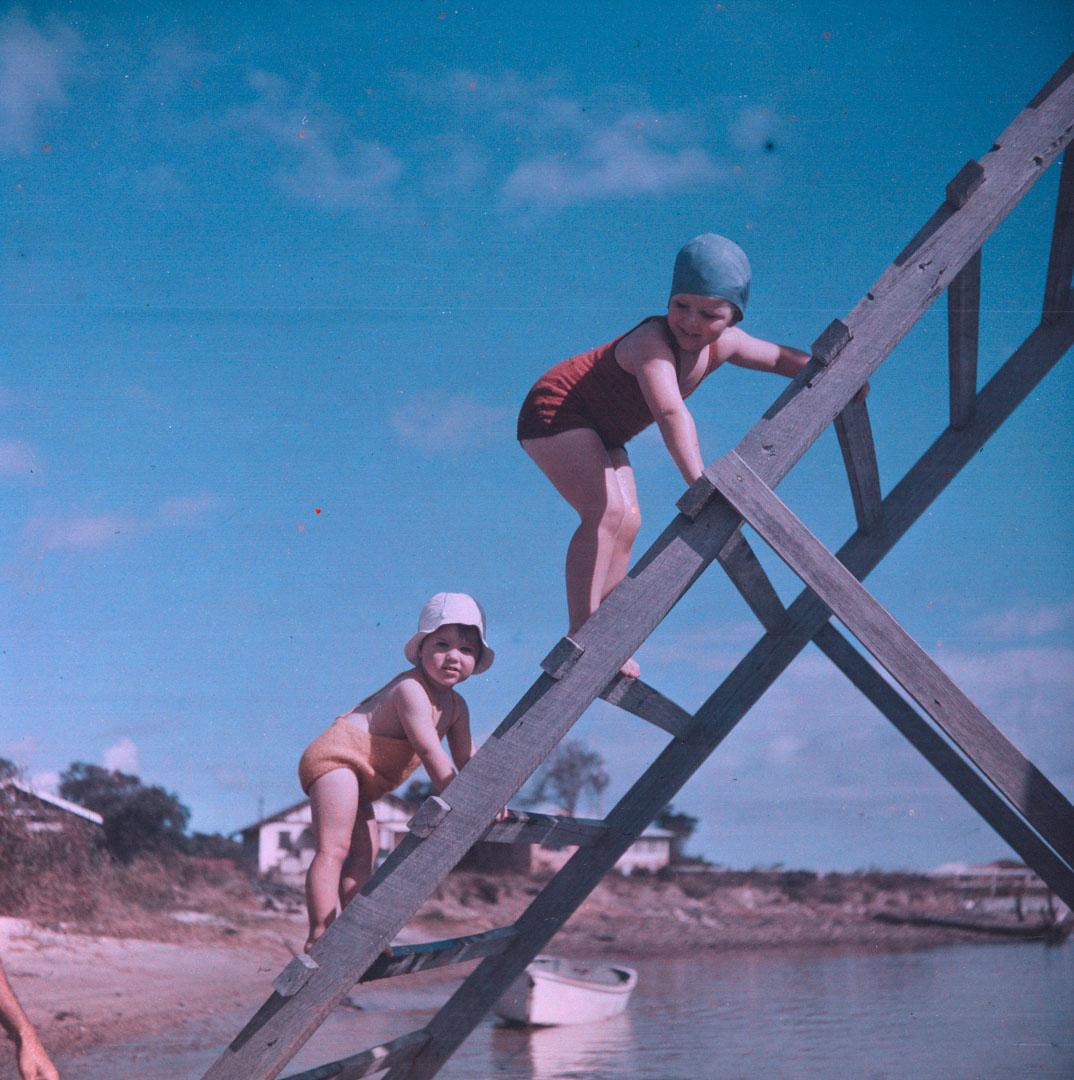 Artwork (Rosemary and Margaret climbing slippery slide in water) this artwork made of Cellulose acetate Dufay colour transparency (originally in a glass mount)