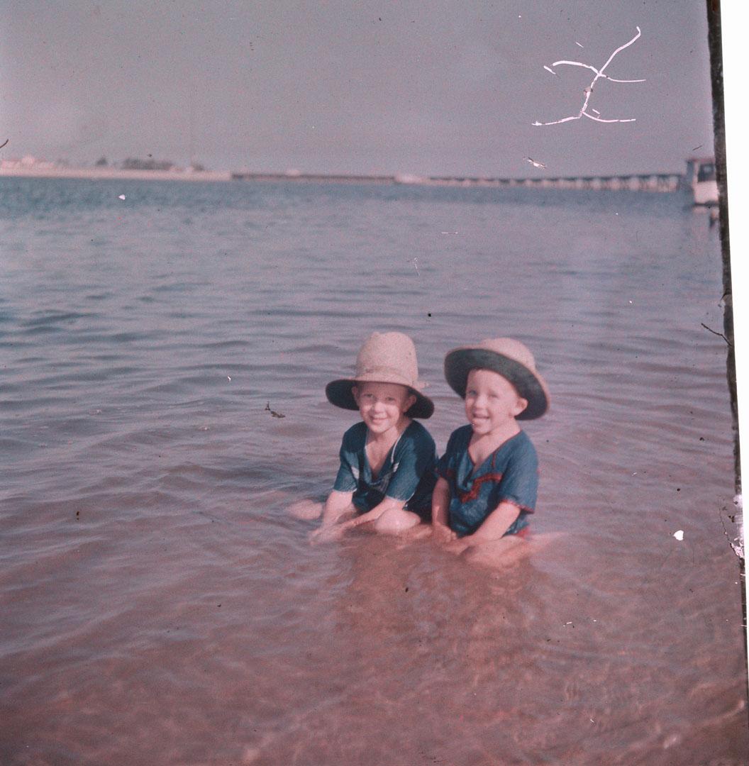 Artwork (Two unidentified small boys in shallow water) this artwork made of Cellulose acetate Dufay colour transparency (originally in a glass mount), created in 1935-01-01