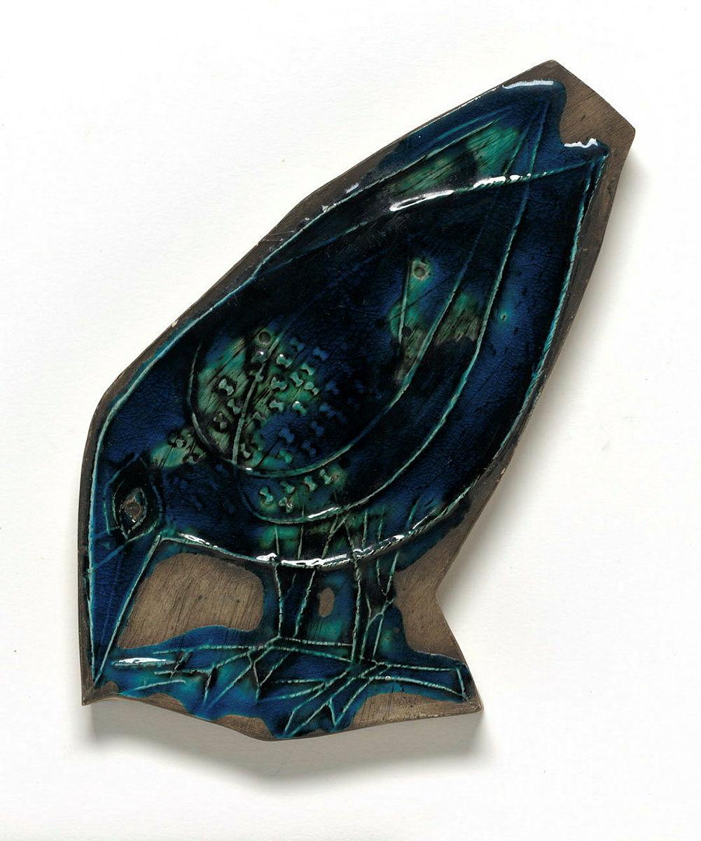 Artwork Tile this artwork made of Earthenware relief moulded in the form of a stylised bird and glazed blue green, created in 1950-01-01