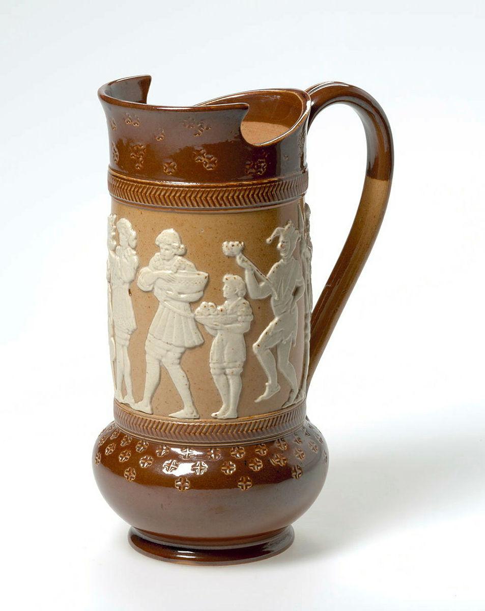 Artwork Jug this artwork made of Stoneware sprigged with a procession of figures in renaissance dress in white on brown with top and bottom stamped with crosses and dipped brown. Salt glazed, created in 1891-01-01