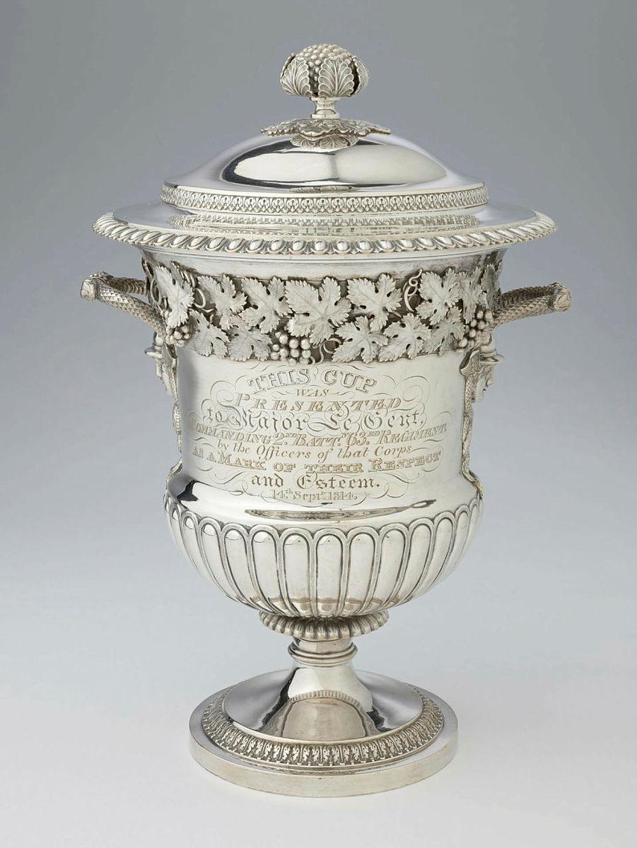 Artwork Covered urn this artwork made of Silver, campagna shaped vase with Mercury head and snake handles with finely cast grape leaves and fruit border. Lid with egg and dart edge and fruiting knop, created in 1814-01-01