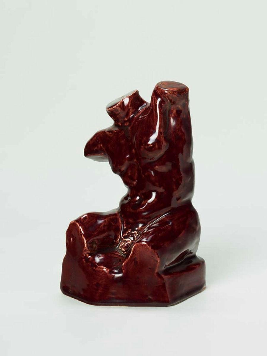Artwork Figurine this artwork made of Earthenware, glazed maroon, created in 1951-01-01