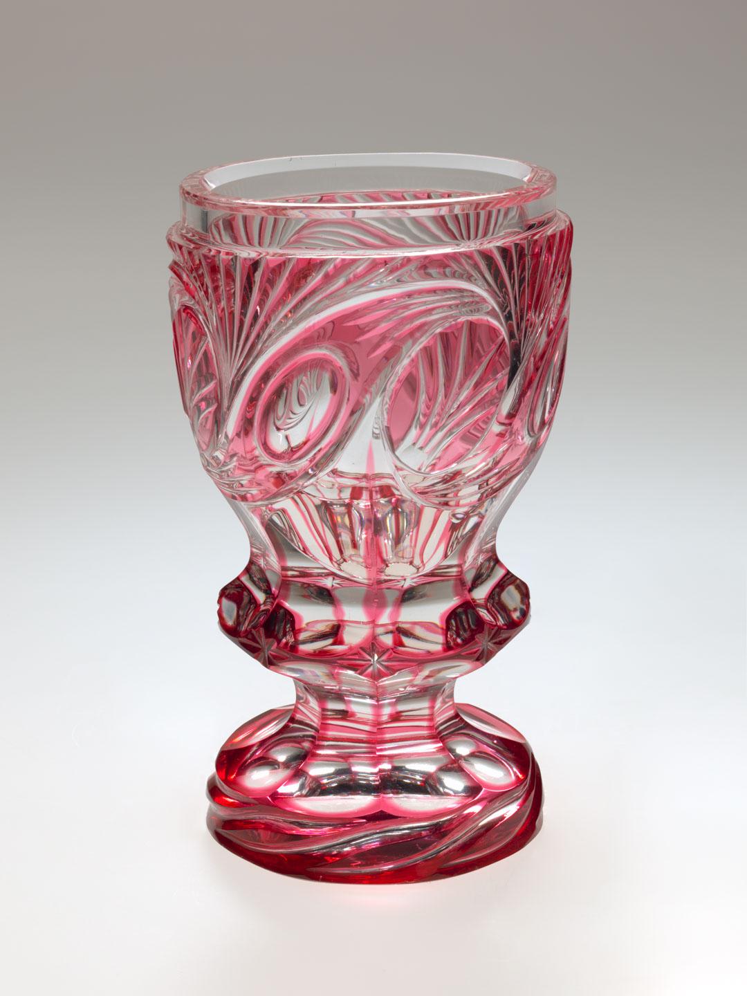 Artwork Goblet this artwork made of Cranberry glass cased over clear and wheelcut with scrolling spray design, created in 1840-01-01