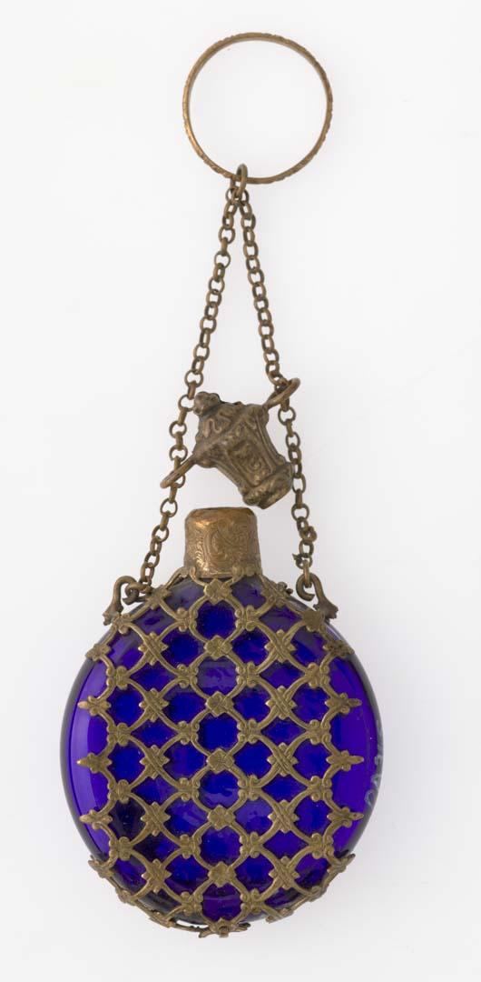 Artwork Perfume flask this artwork made of Cobalt glass with pierced brass case, created in 1850-01-01