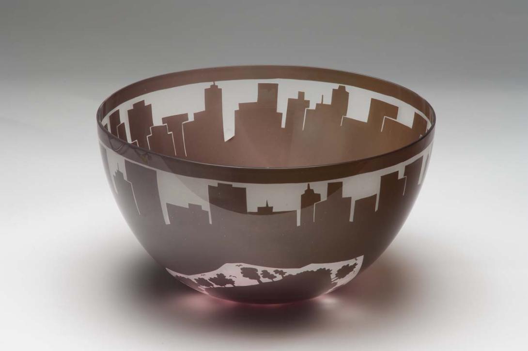 Artwork Bowl:  Encroachment this artwork made of Hot-worked clear glass overlaid amethyst and sandblasted, created in 1982-01-01